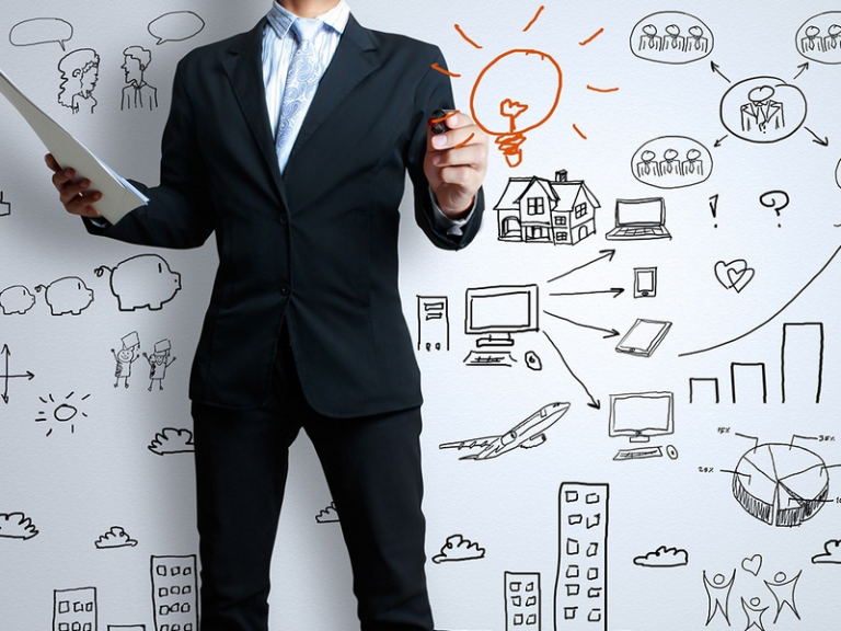 A businessman holding a tablet with a drawn lightbulb icon and various business strategy sketches on a white background.